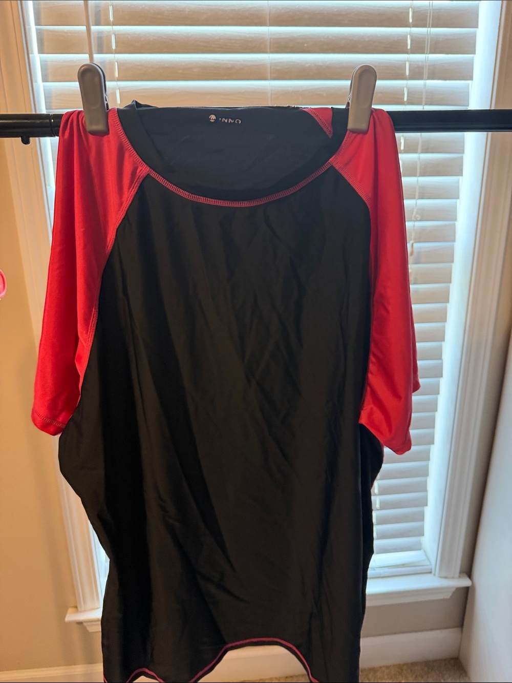 Black and hot pink swim shirt with black shorts